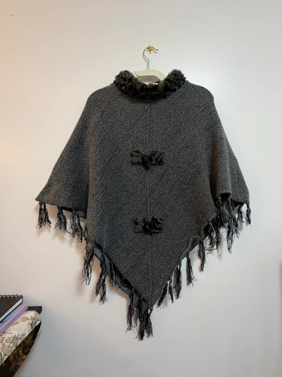 Grey knit poncho with faux fur trim