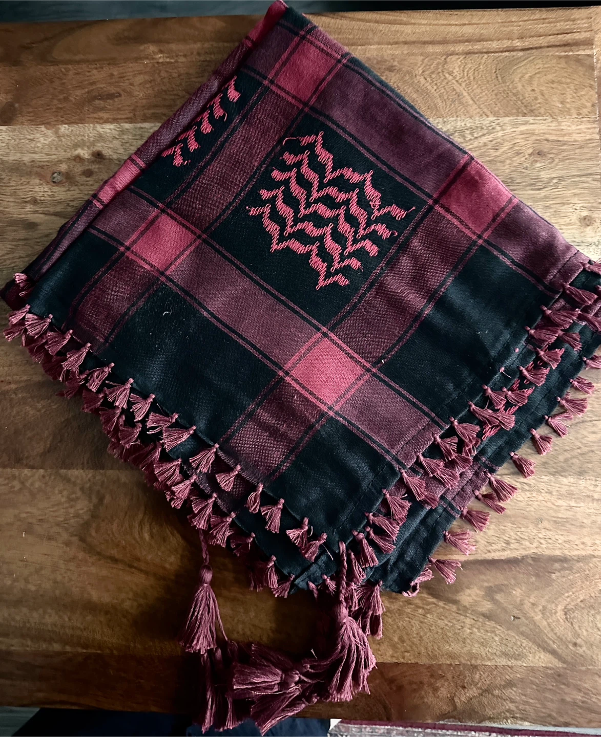 Red and black plaid scarf with tassels