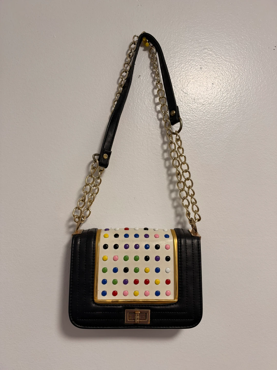 Black and white crossbody bag with multi-coloured studs