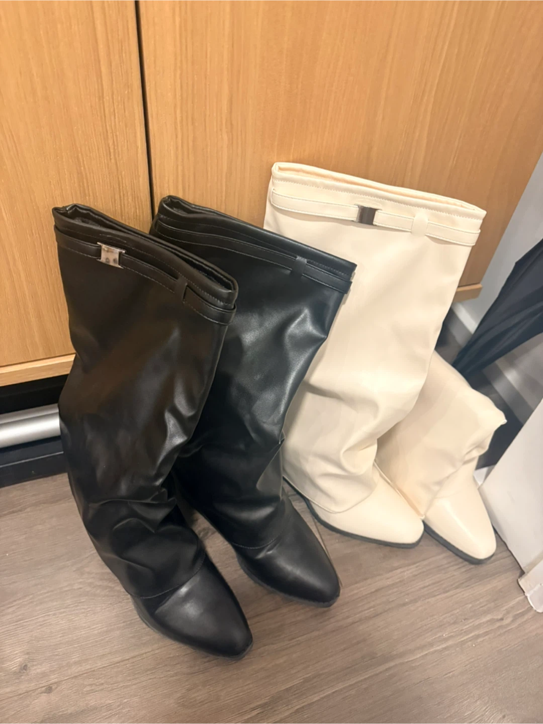 Two pairs of boots, black and cream