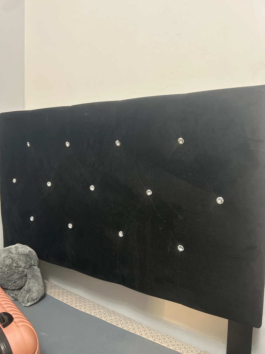 Black velvet upholstered bed headboard