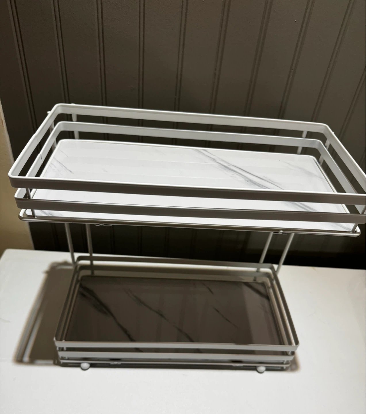 Two-tier white metal storage shelf