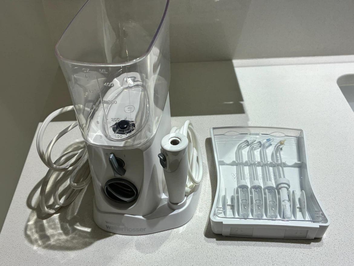 Waterpik Water Flosser (NANO) with 4 unused attachments