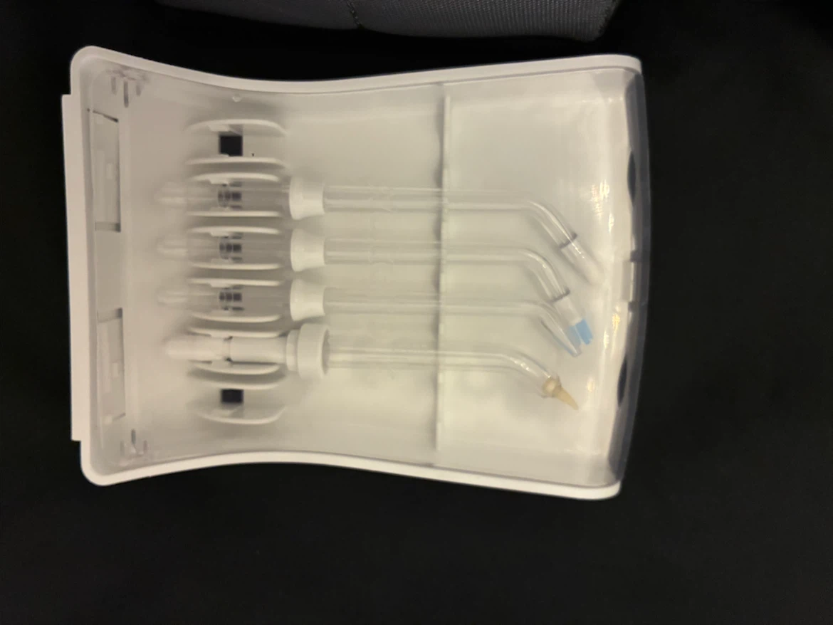 Waterpik Water Flosser (NANO) with 4 unused attachments - photo 2