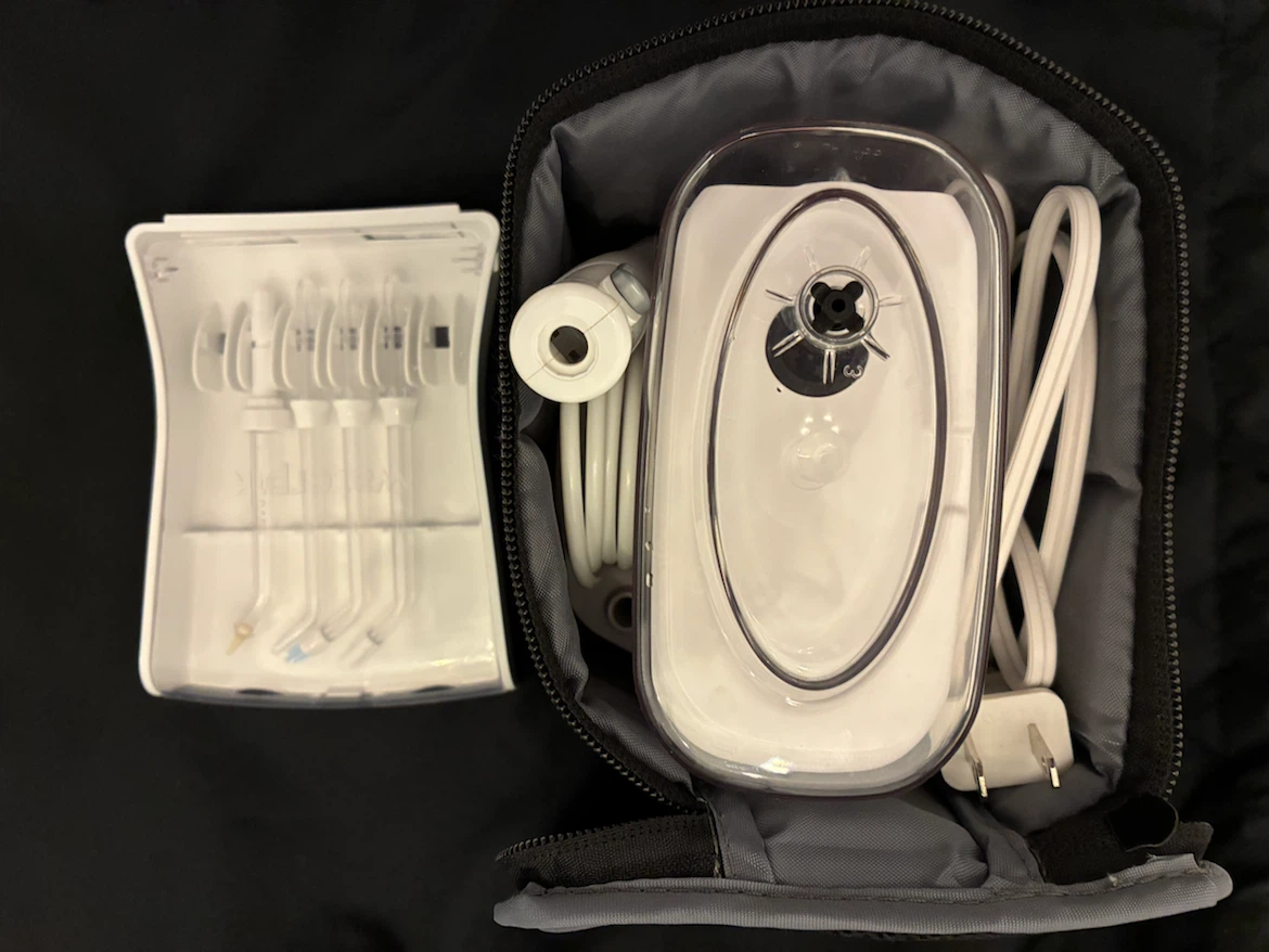 Waterpik Water Flosser (NANO) with 4 unused attachments - photo 3