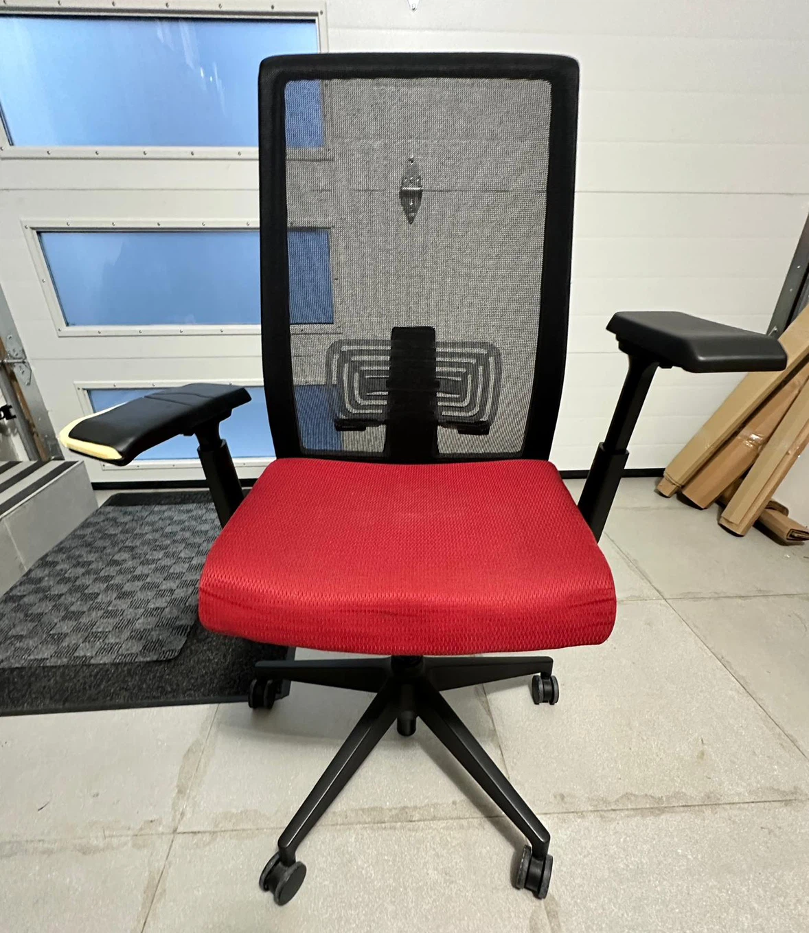 Office chair with mesh back and red seat