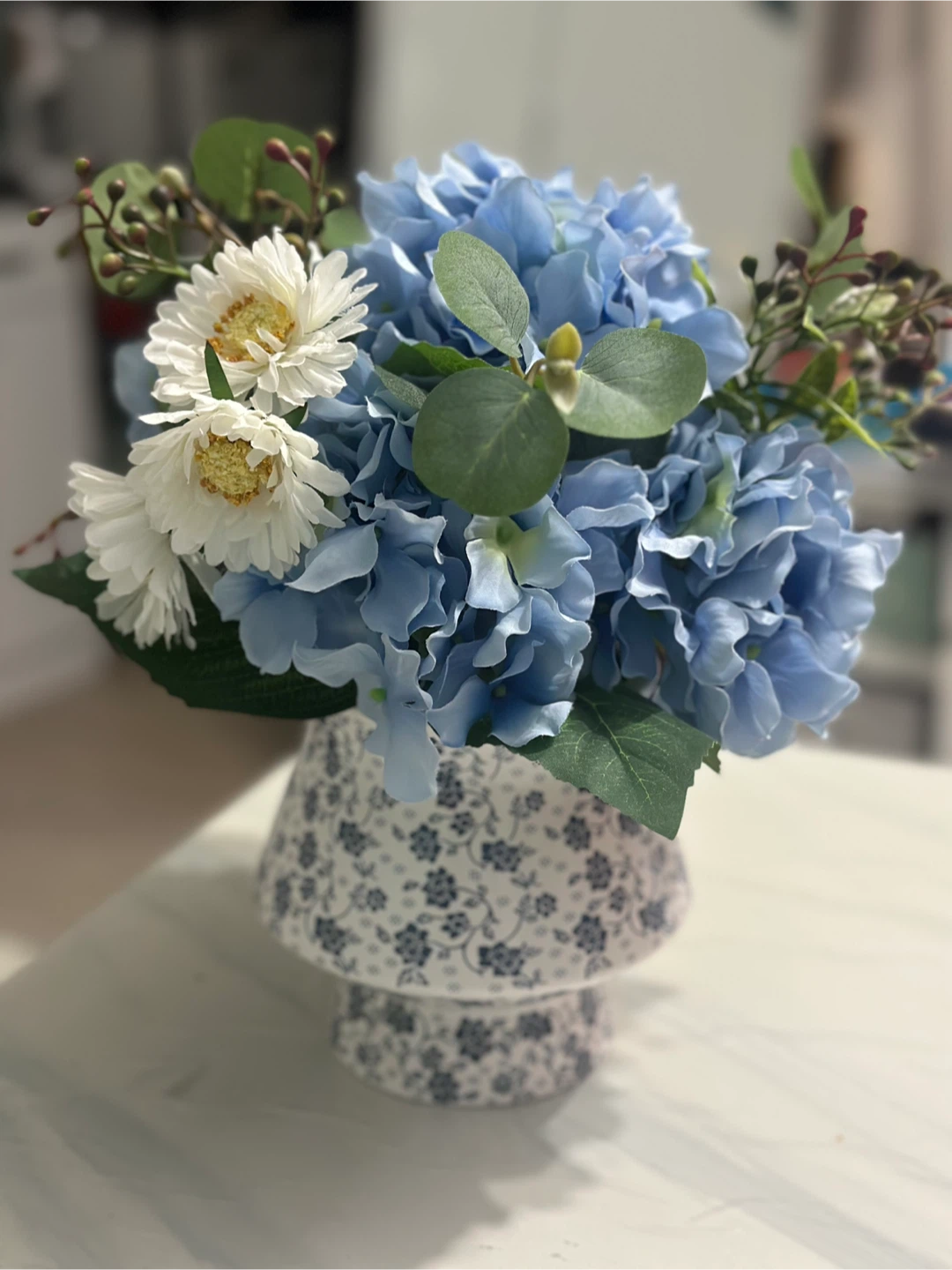 Floral Arrangement in Blue and White Vase