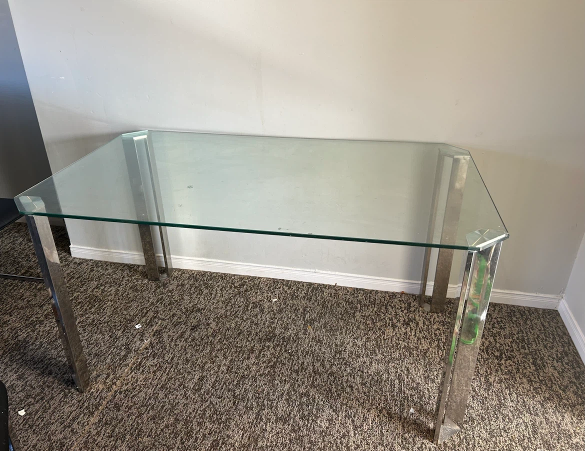 Glass top dining table with chrome legs