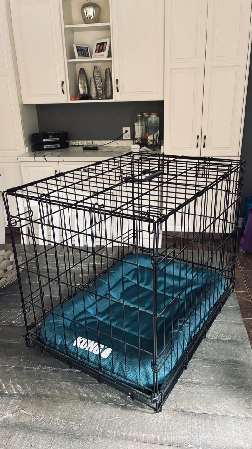 Small pet crate with bed