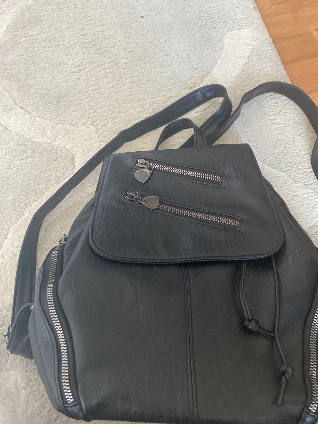 Black synthetic leather backpack