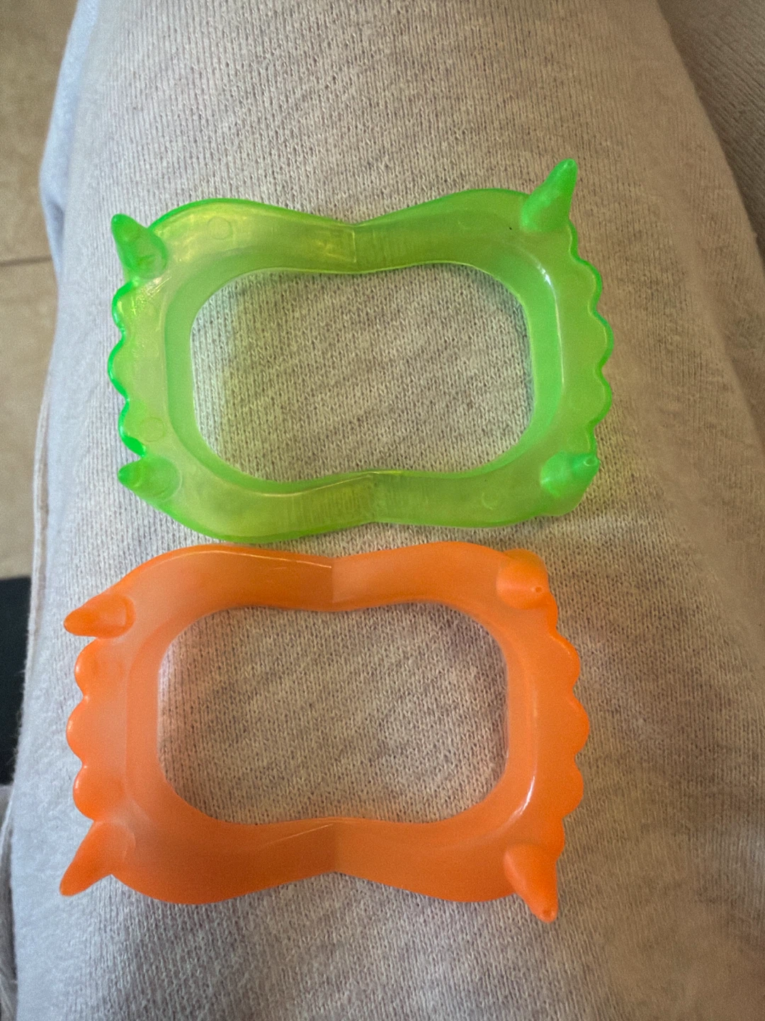 Two plastic vampire fang toys