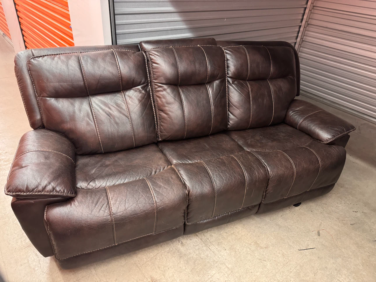 Dark brown leather reclining sofa
