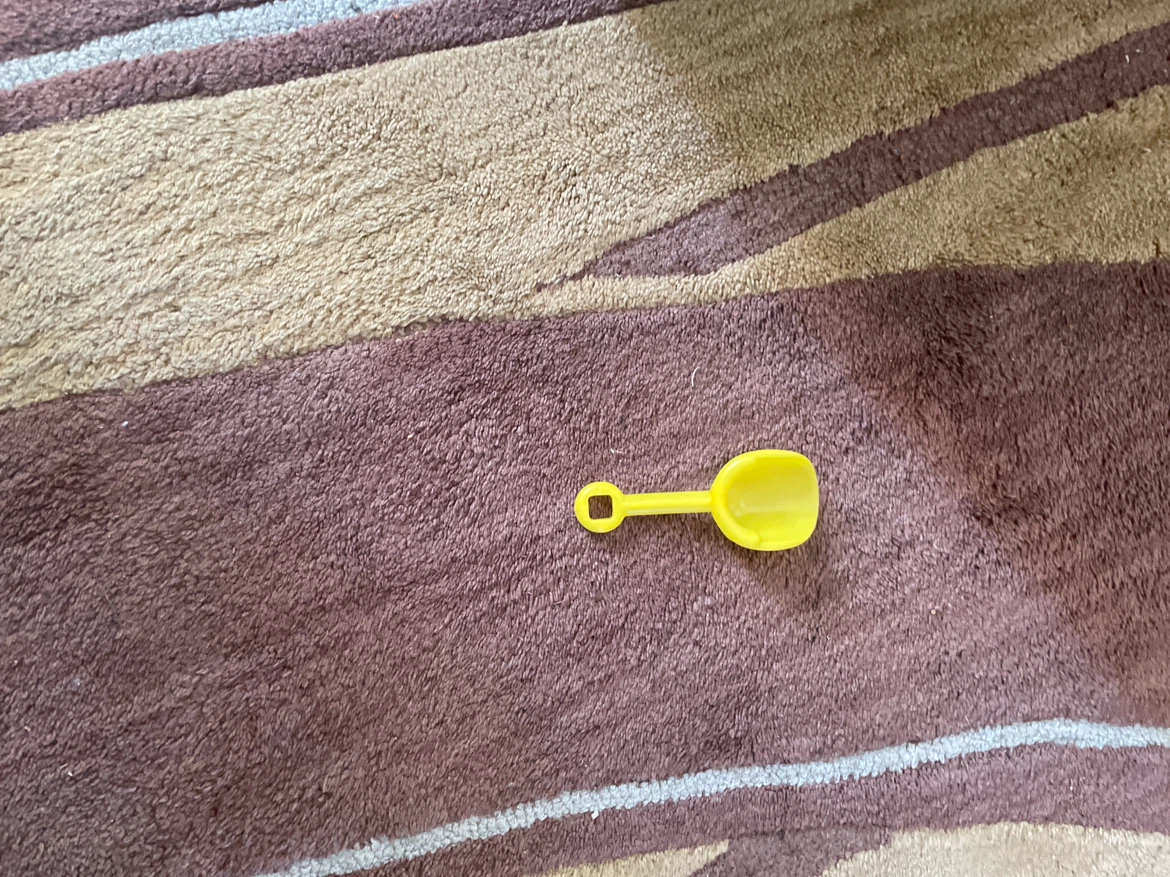 Small Yellow Plastic Toy Shovel