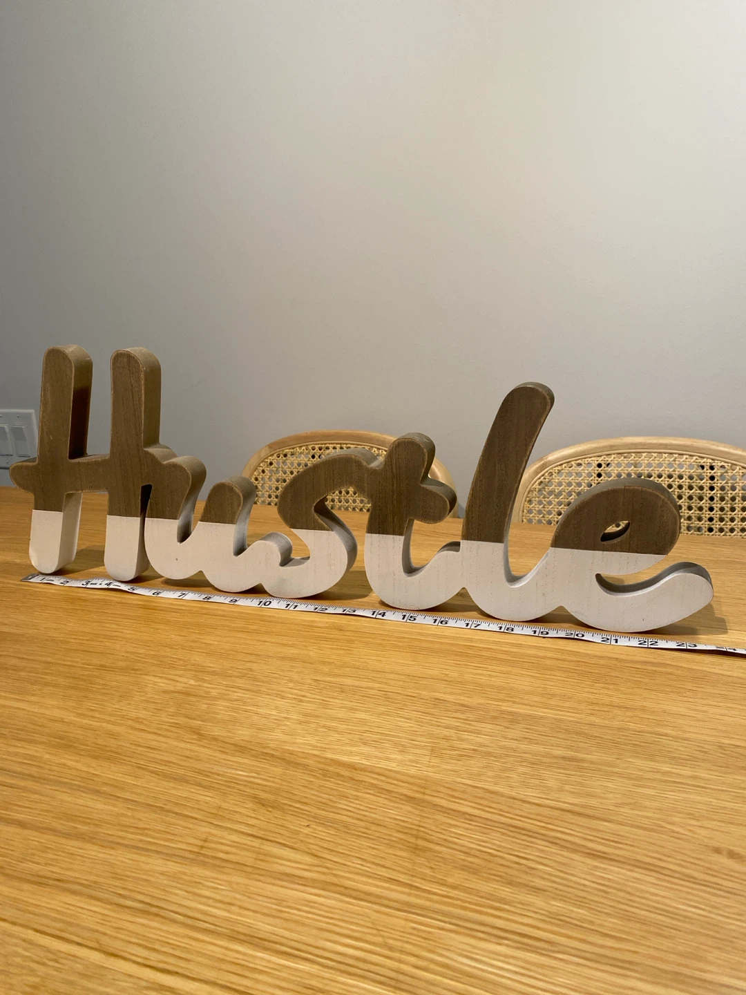 Wooden “Hustle” sign decor
