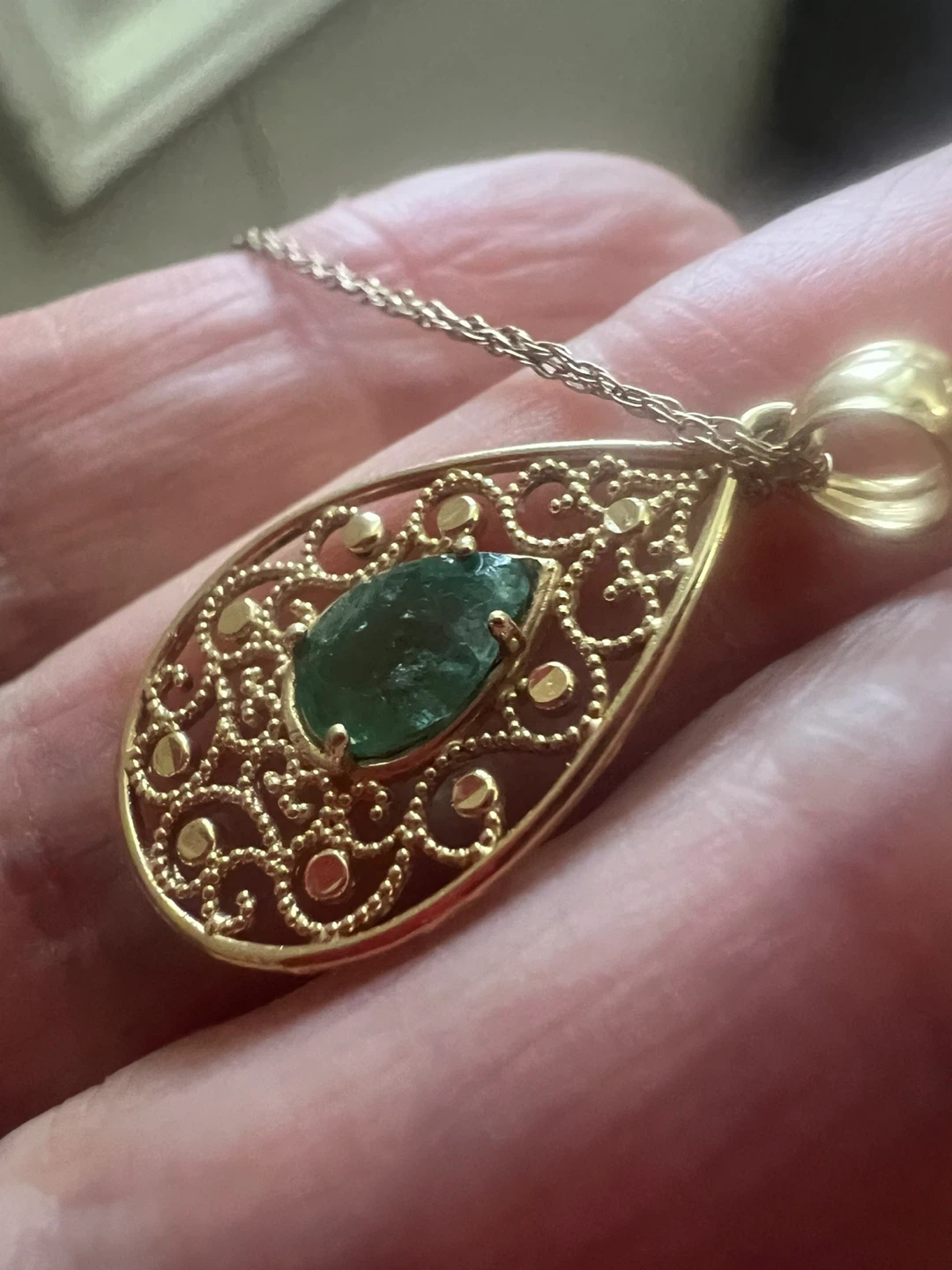 14 k emerald and 10 k chain