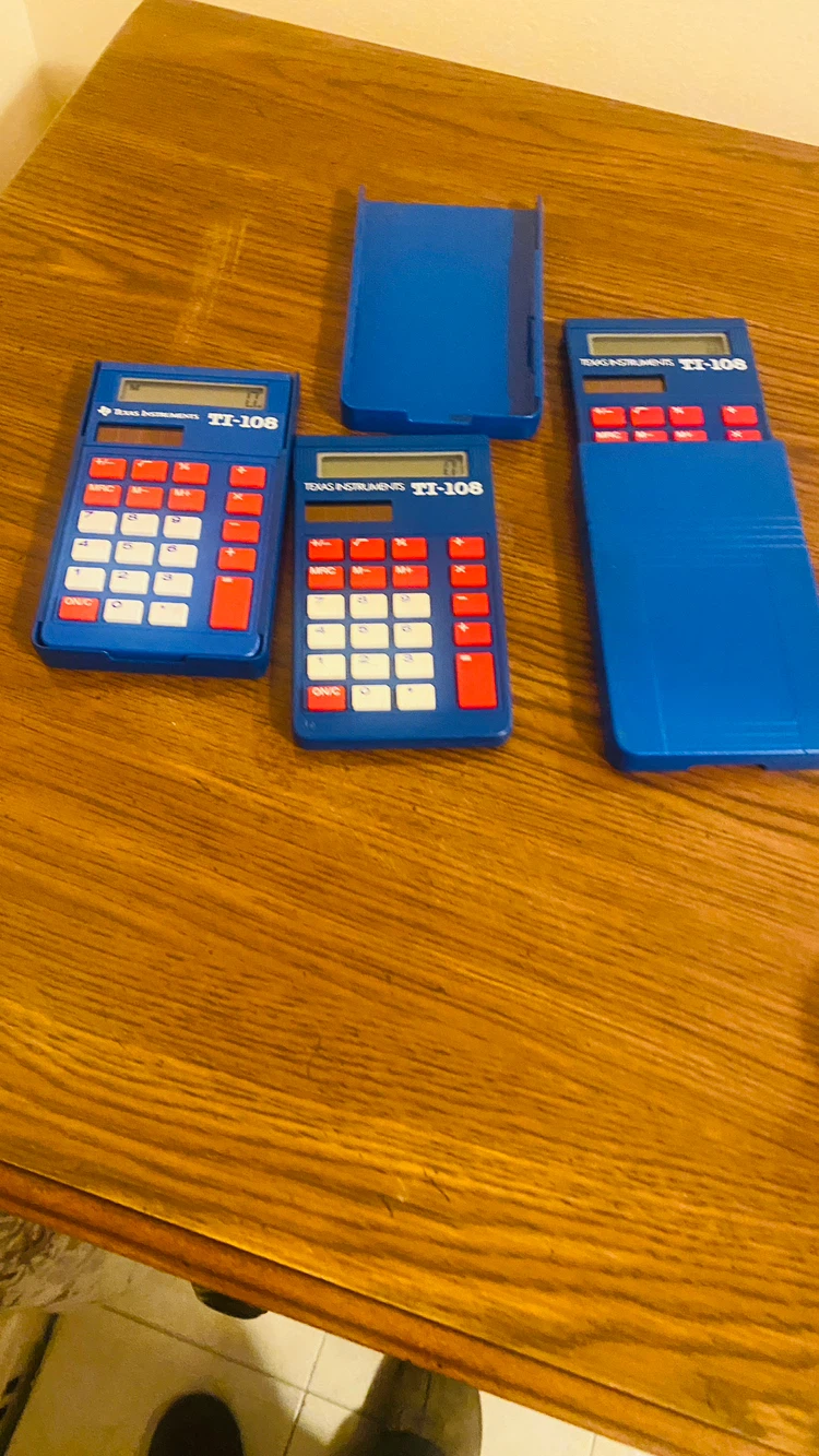 3 Texas Instruments solar powered calculators