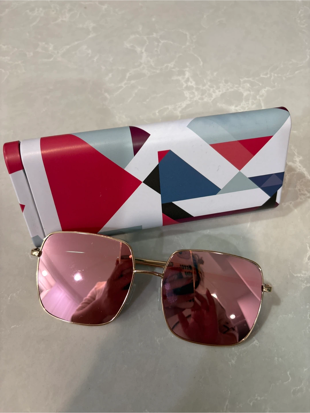 Rose gold square sunglasses with geometric case