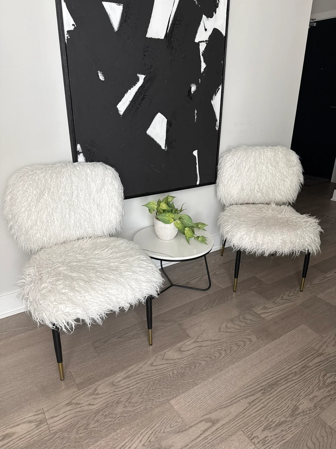 Set of two white faux fur accent chairs