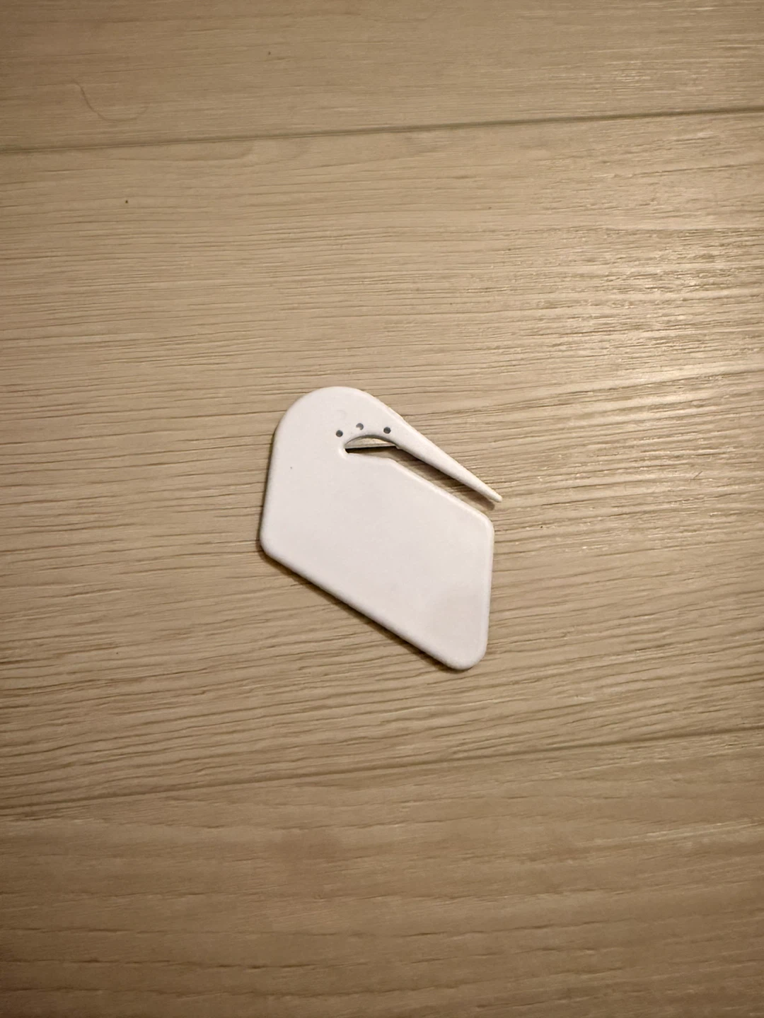 White plastic letter opener