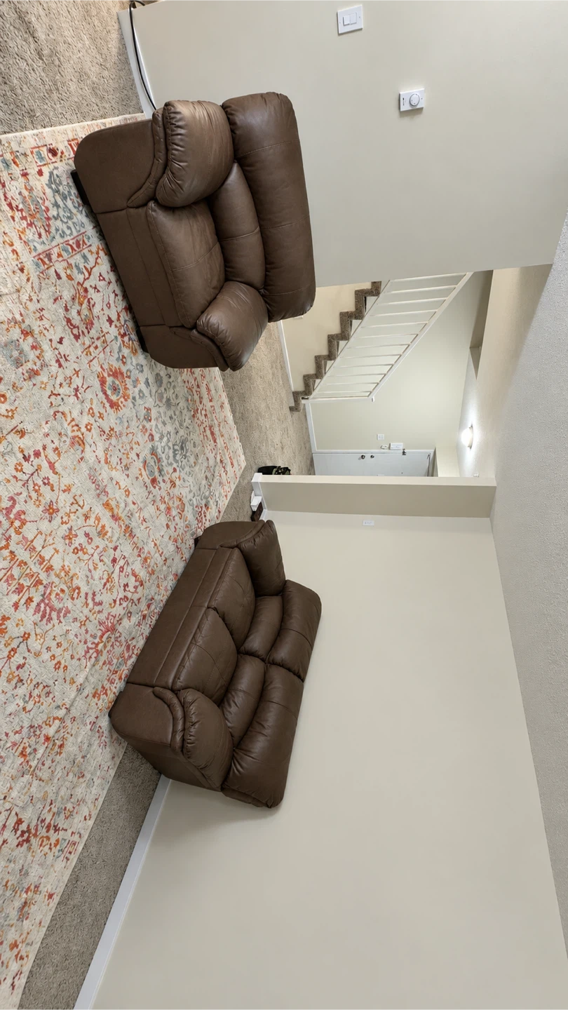 Excellent Brown Leather Reclining Loveseat
