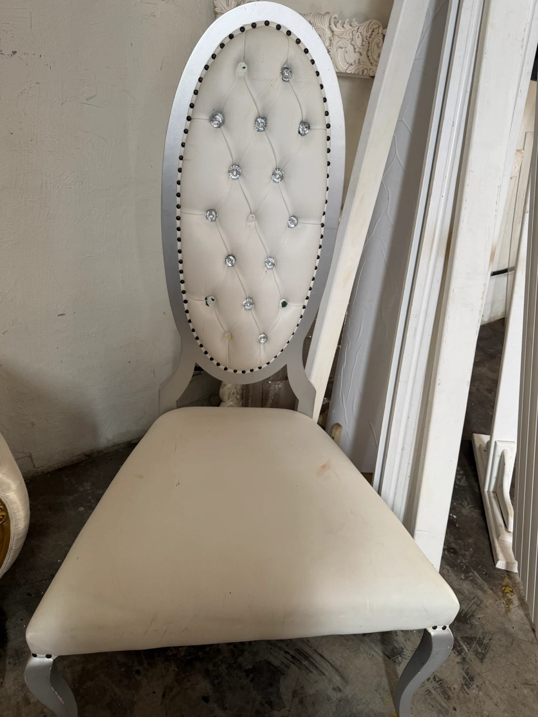 White tufted dining chair with silver frame