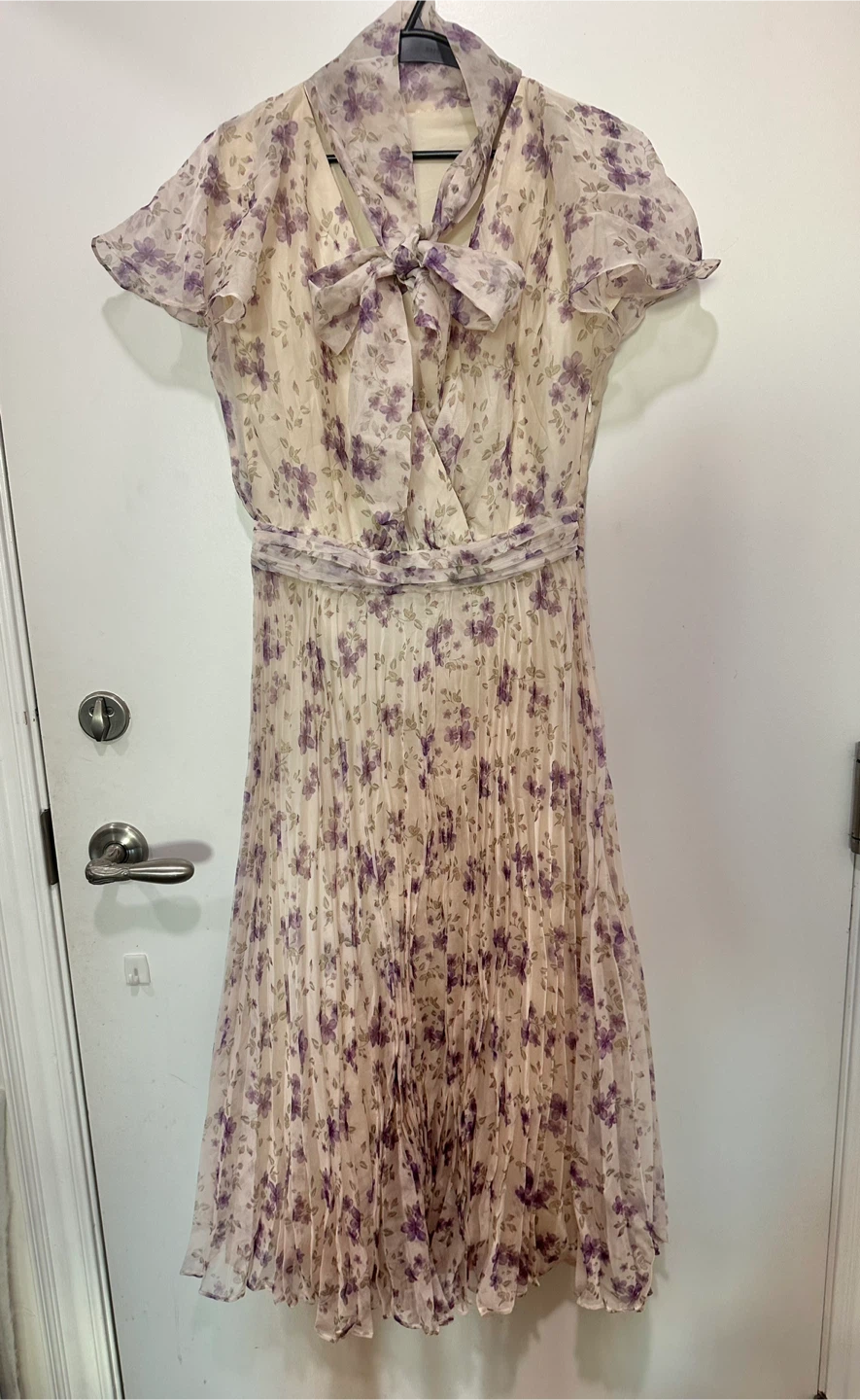 purple floral chiffon midi dress featuring a neck tie-bow