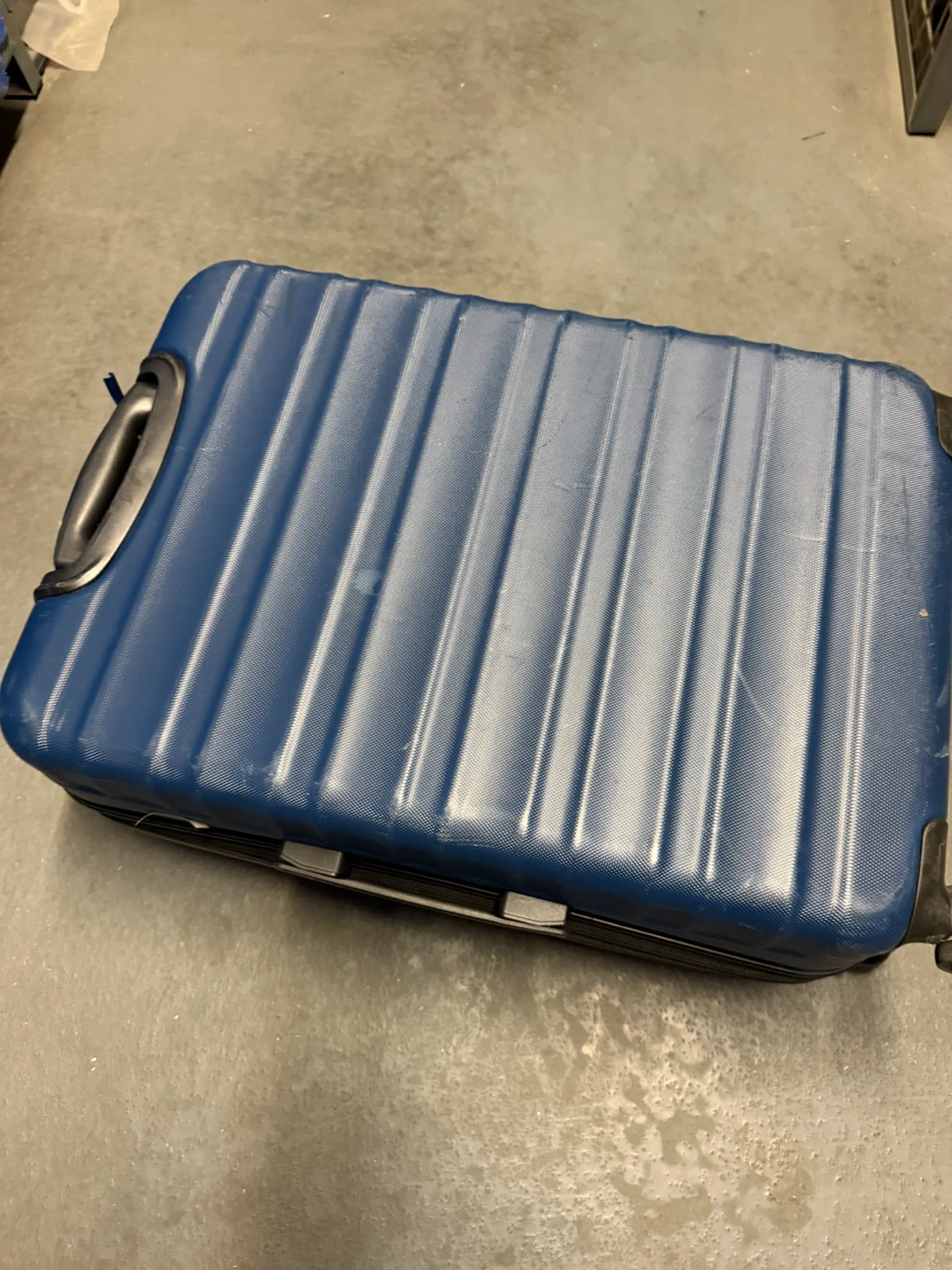 AmazonBasics blue hard-shell spinner luggage