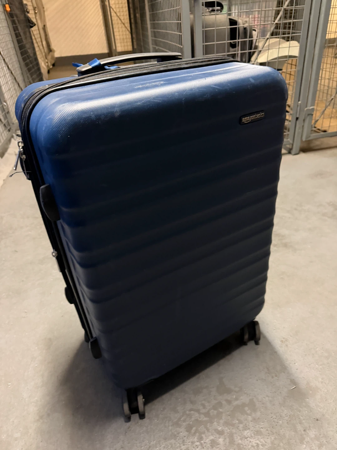 AmazonBasics blue hard-shell spinner luggage - photo 3