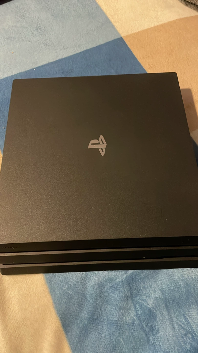 Sony PlayStation 4 Pro Console with 4 Games