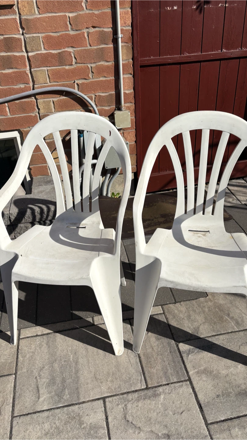 Two White Plastic Patio Chairs