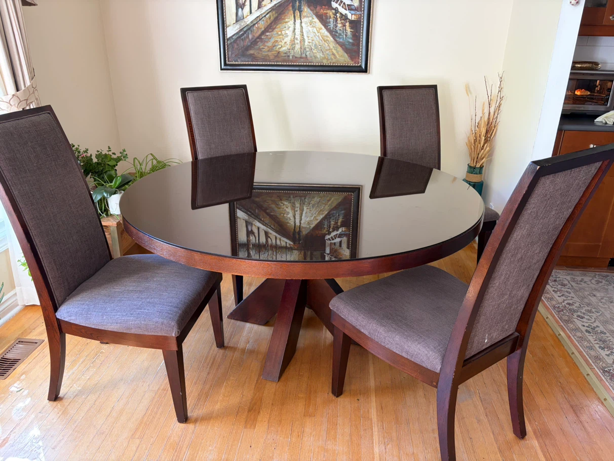 Round wooden dining table with 4 chairs