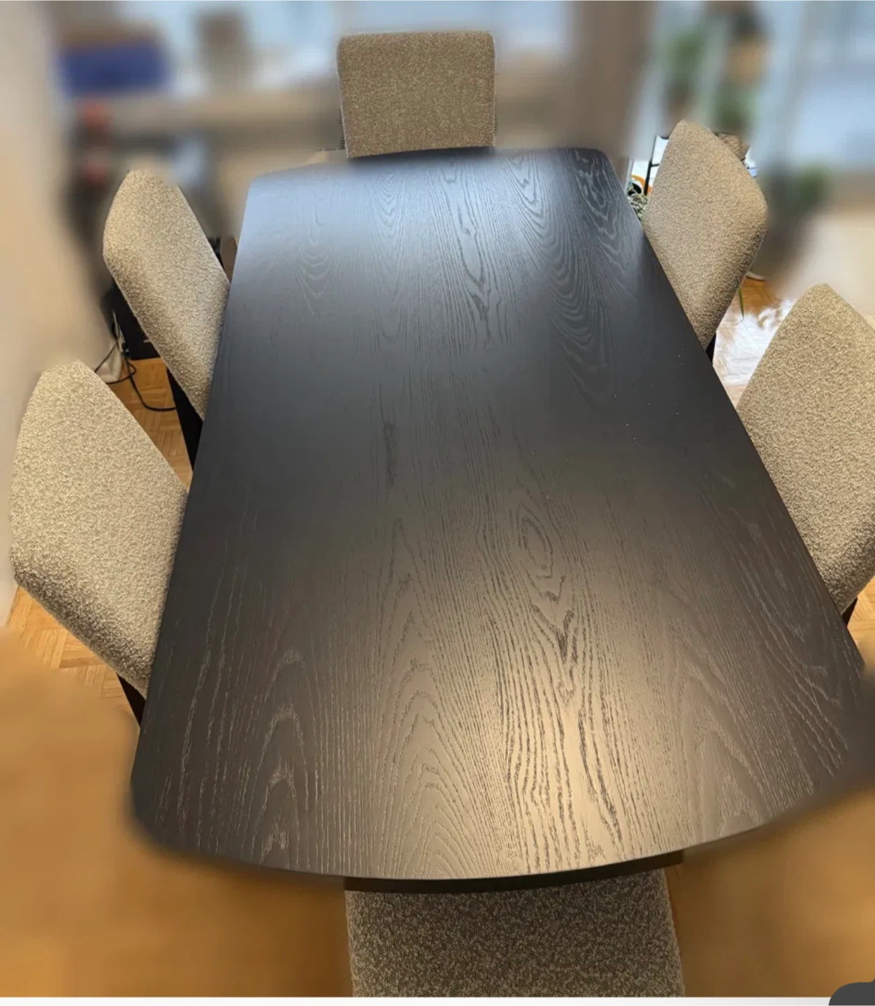 Black Dining Table with Six Grey Upholstered Chairs