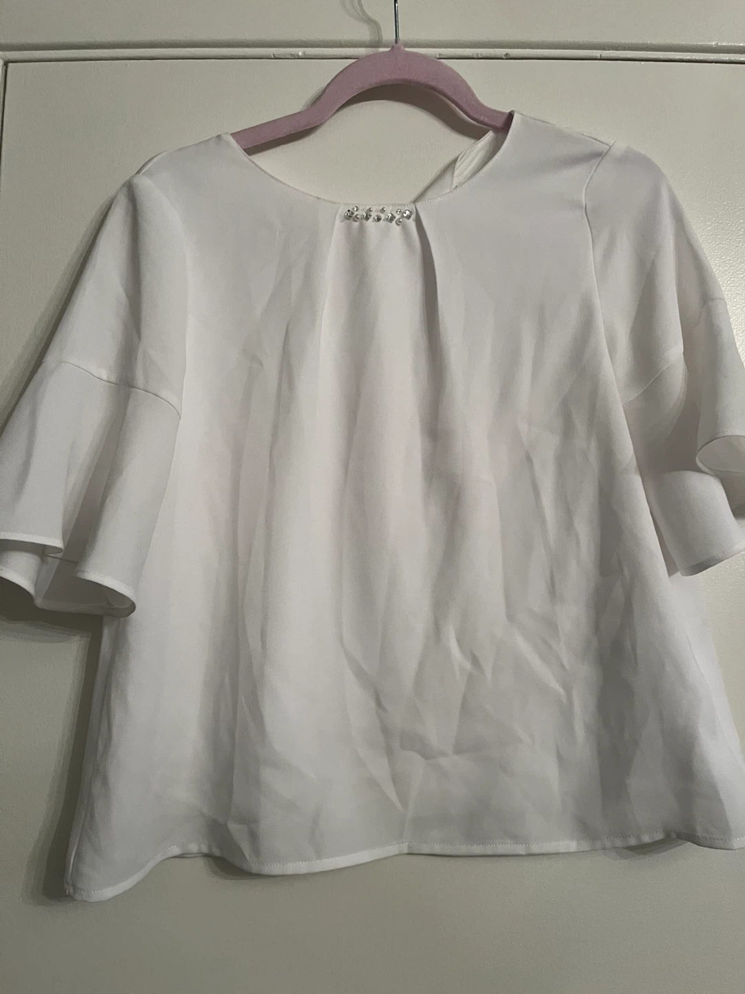 White blouse with rhinestone detail