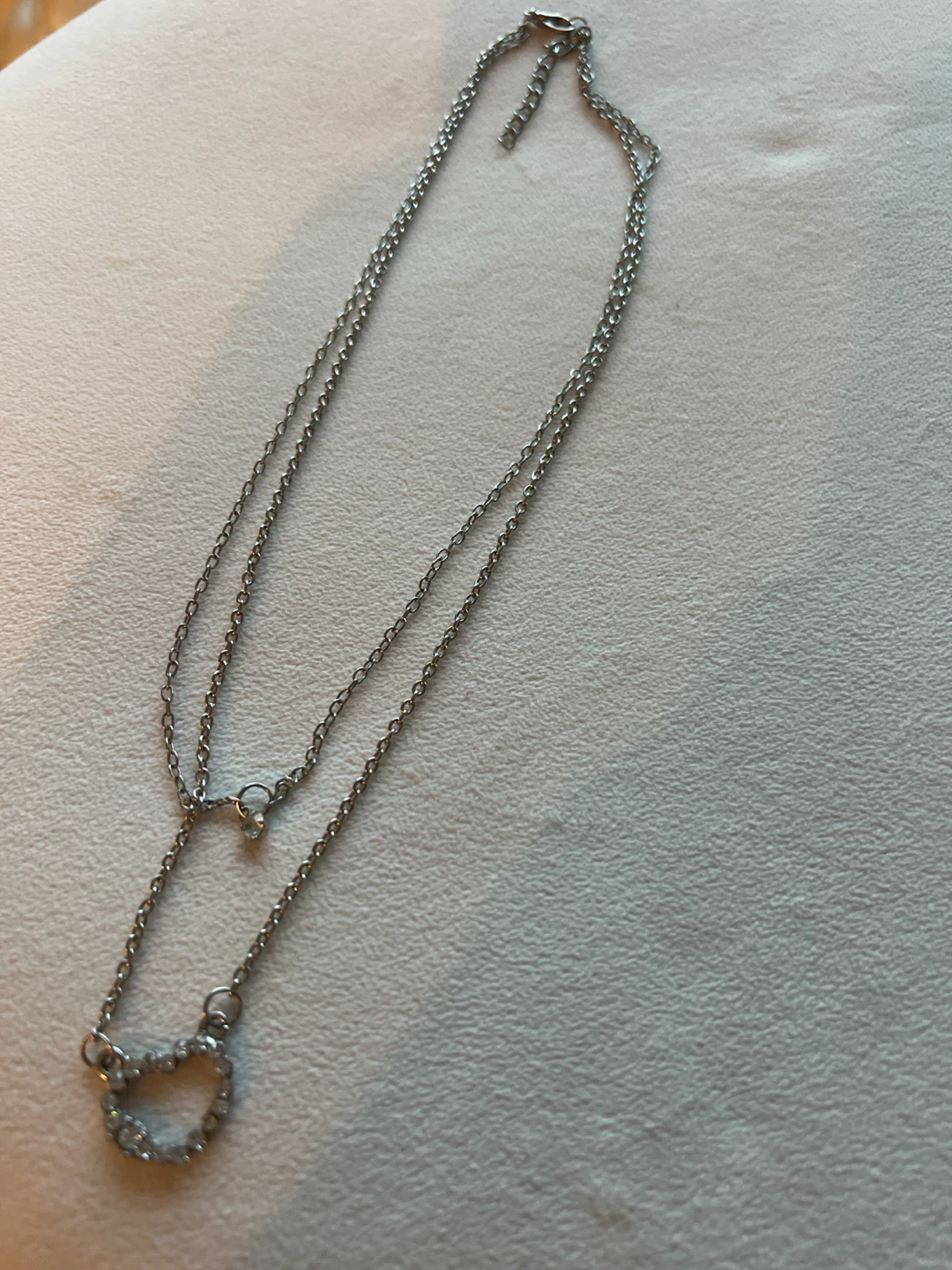 Silver color necklace with heart layered