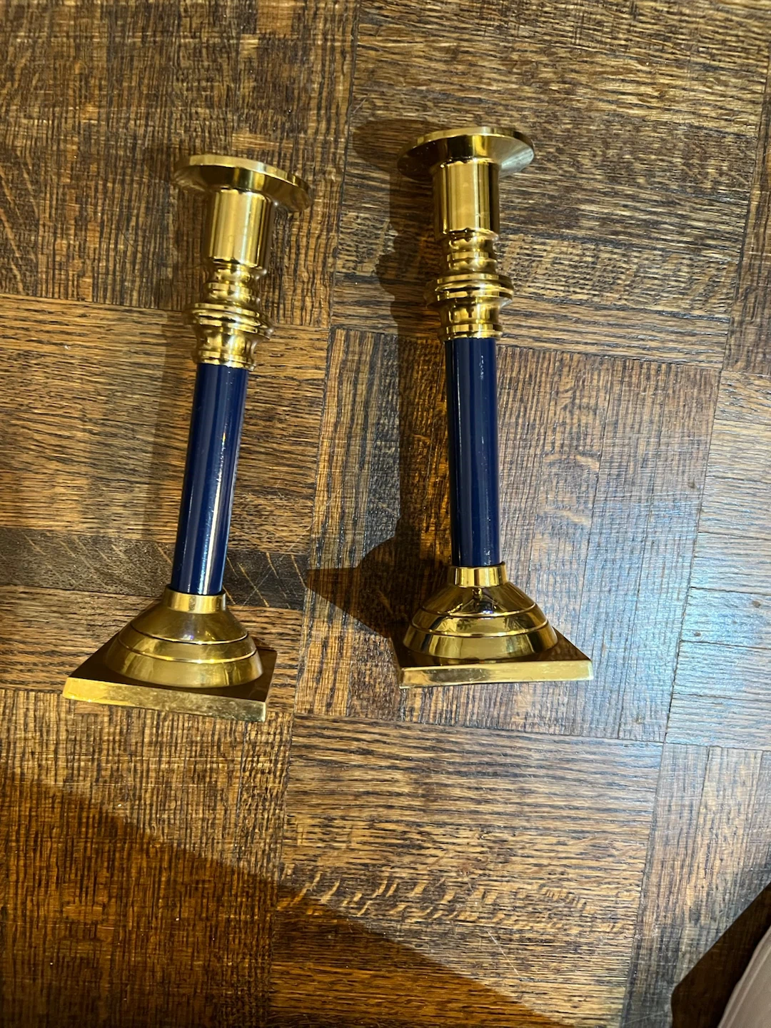 Set of two brass and blue candle holders