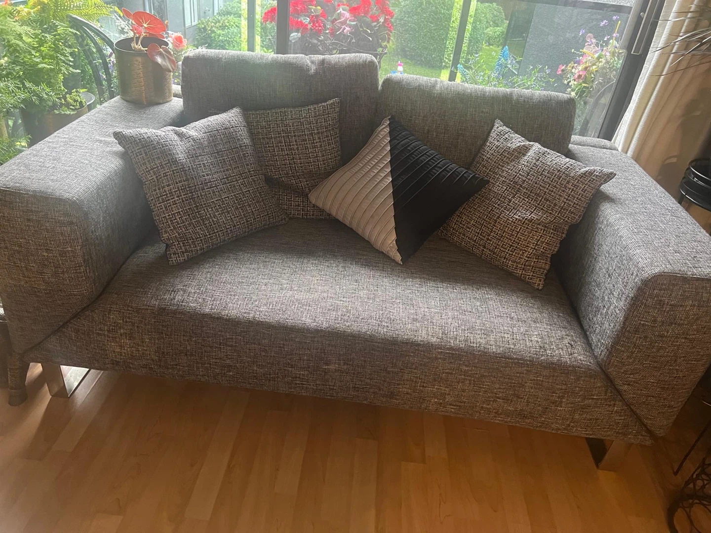 Grey Fabric Sofa with Throw Pillows and bed