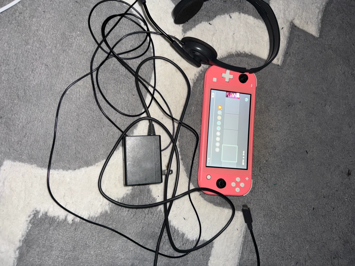 Coral Nintendo Switch Lite with Charger and Headset