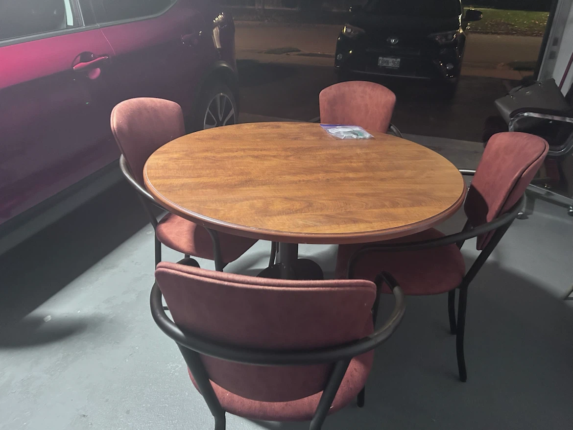 Round wooden dining table with 4 chairs