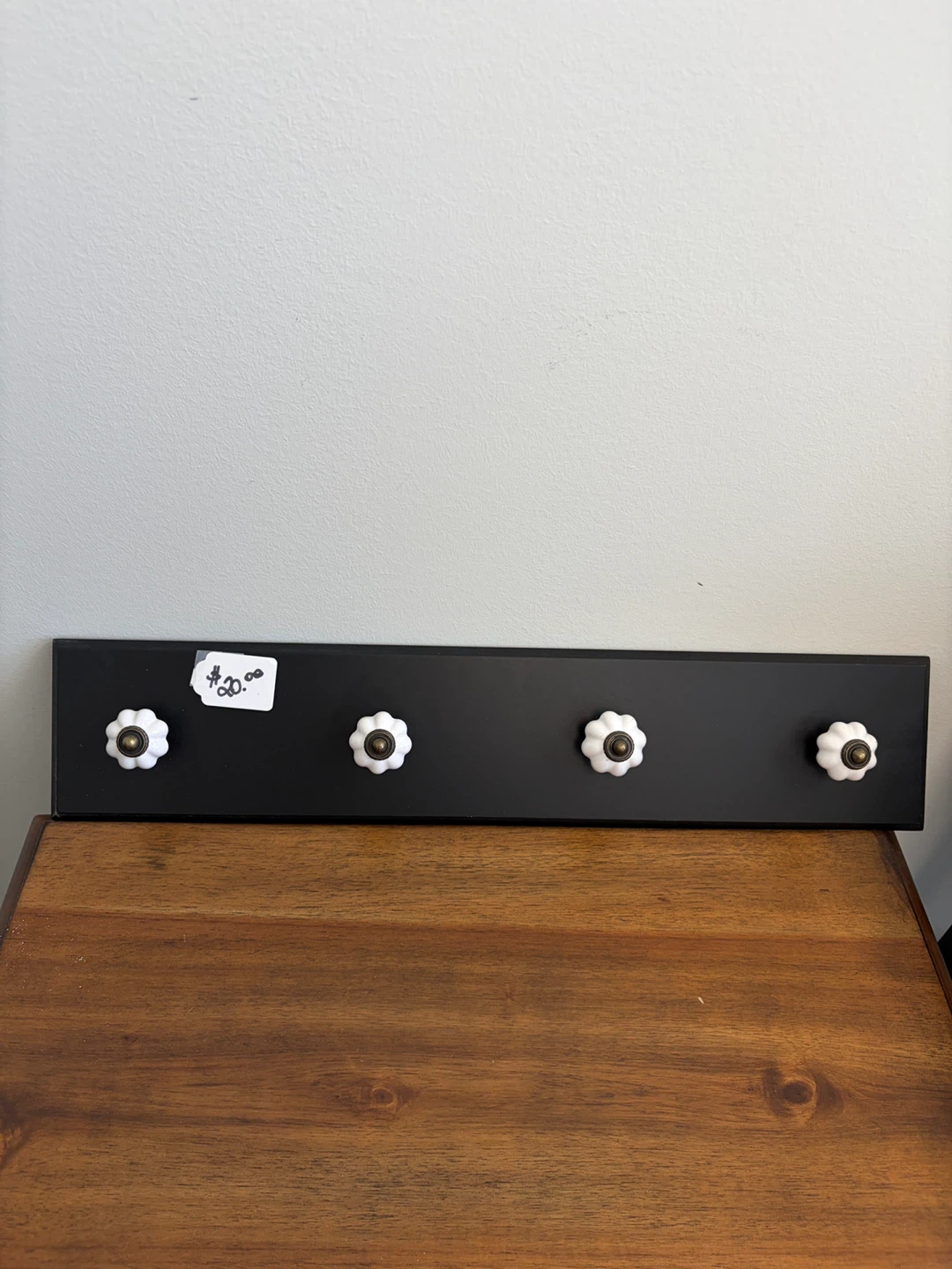 Black Wall Hook Rail with White Ceramic Knobs