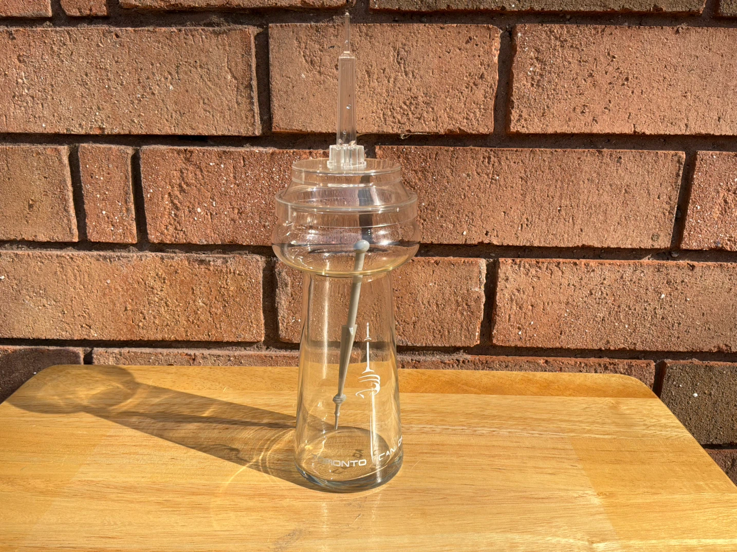 CN Tower Glass With Plastic Top and Stirrer