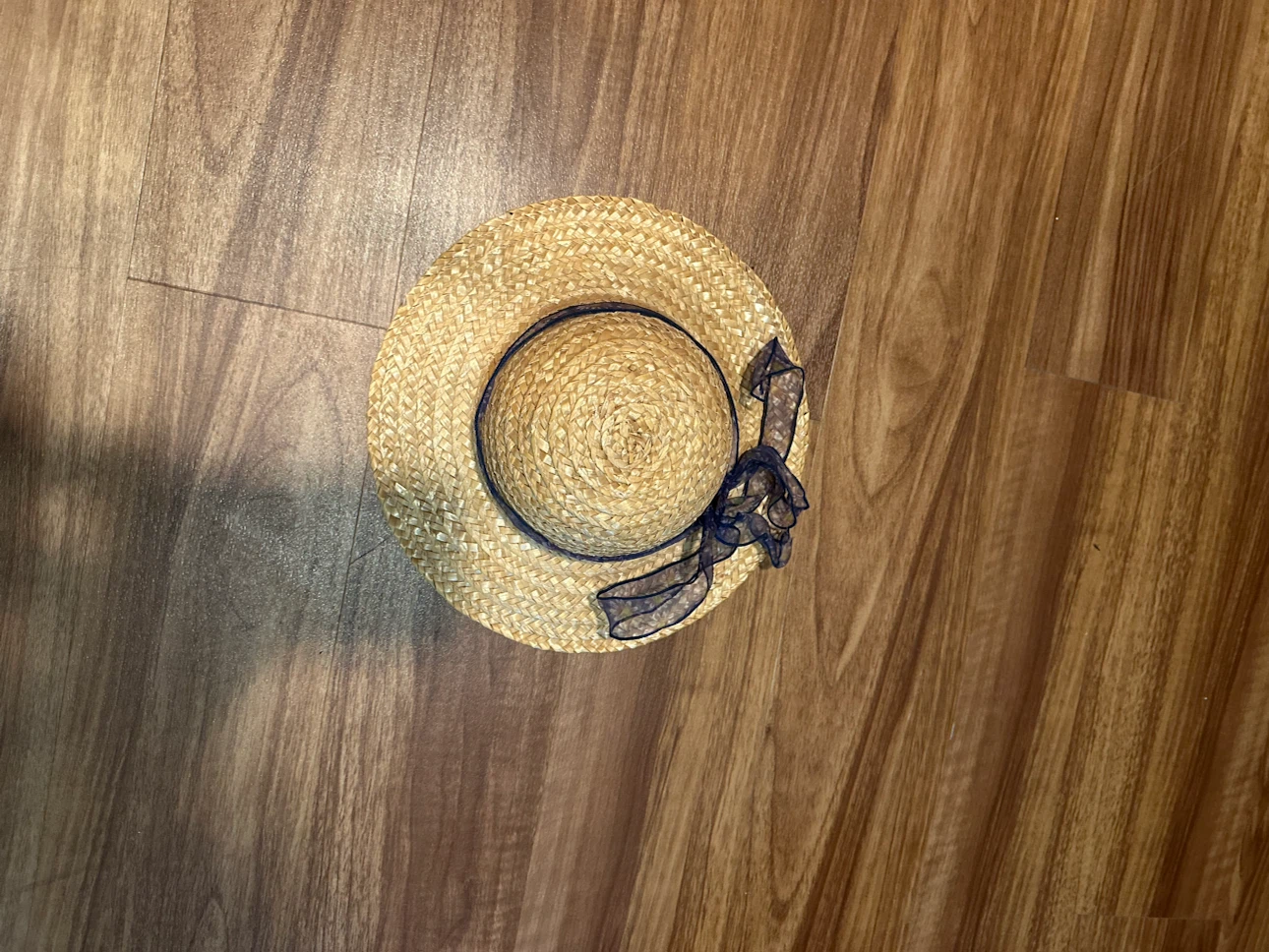 Straw boater hat with navy ribbon