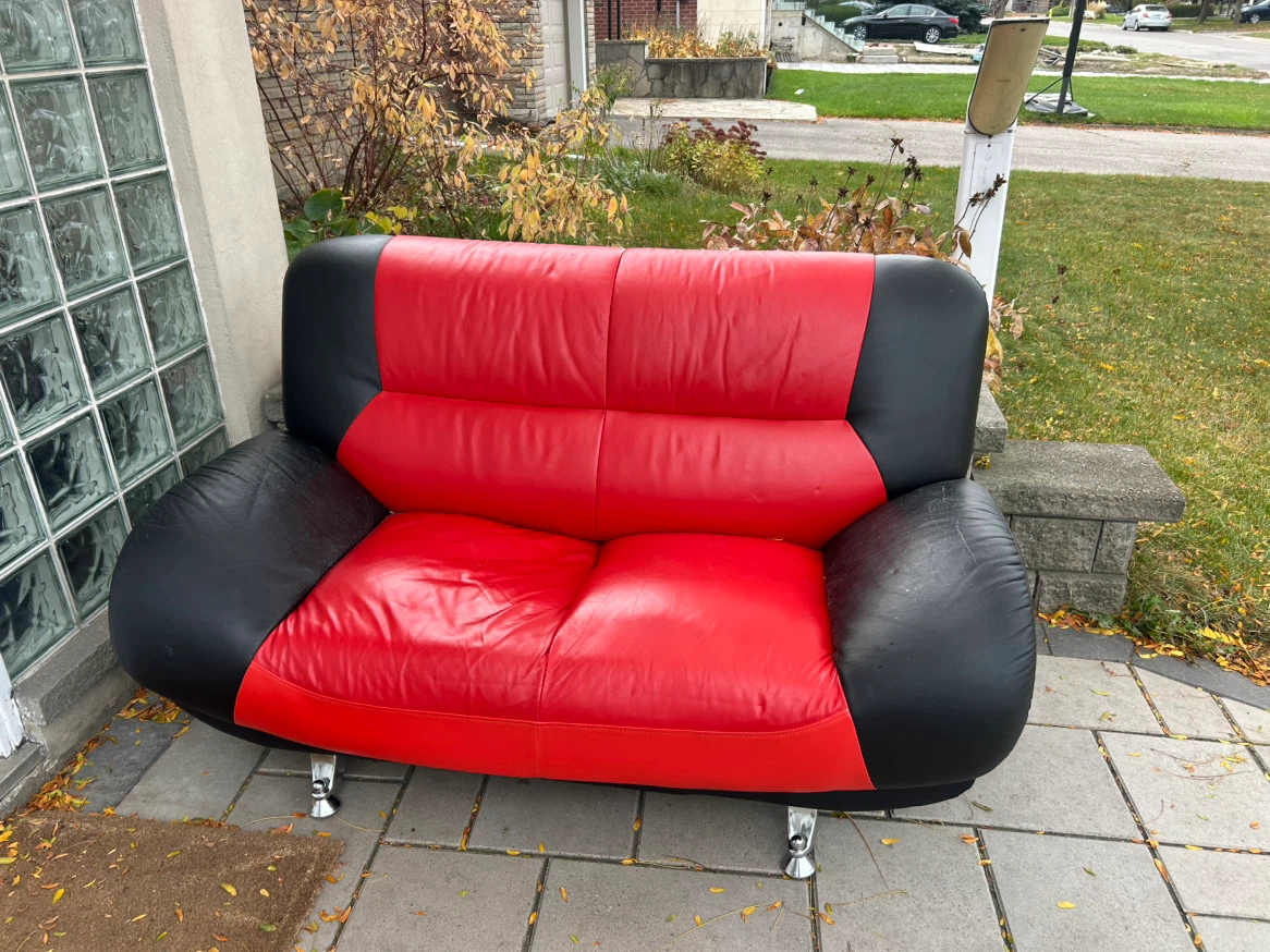Red and black two-seater sofa