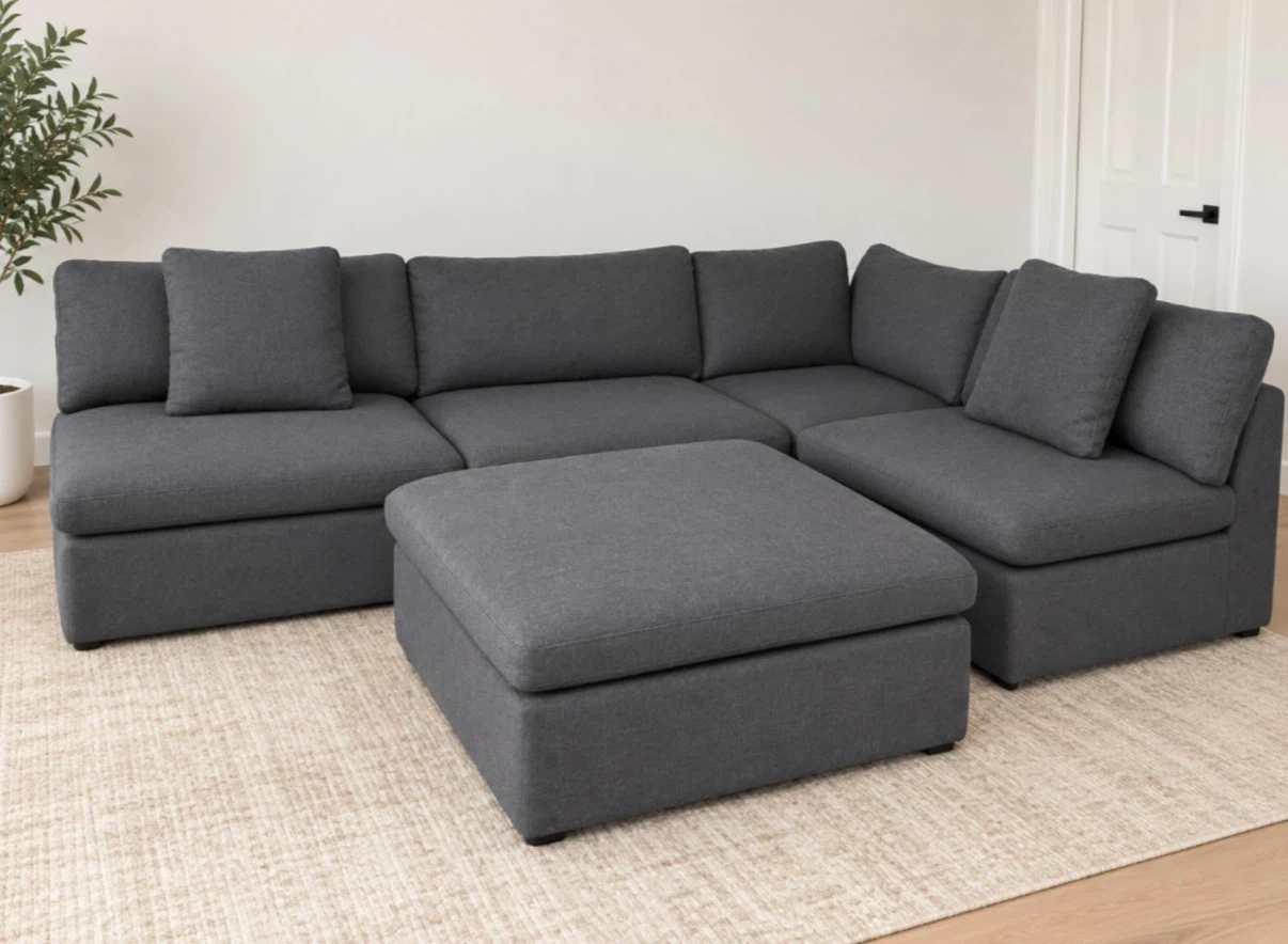 Dark grey modular sectional sofa with ottoman