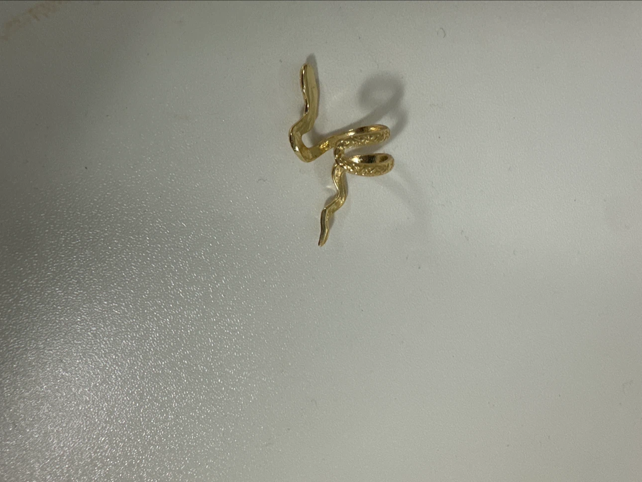 Gold-tone snake ear cuff