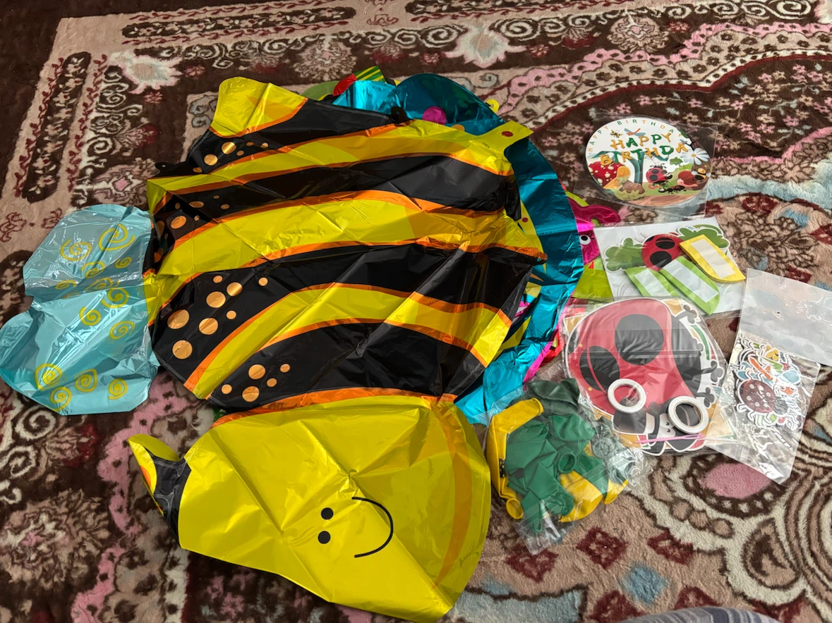 Bee-themed party decorations and balloons