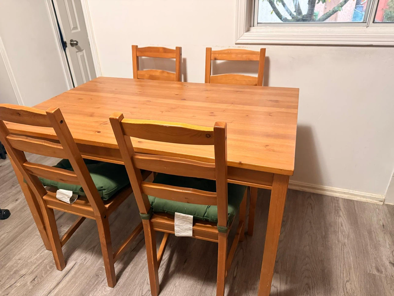 IKEA Pine Dining Table and 4 Chairs.( includes chair pads)