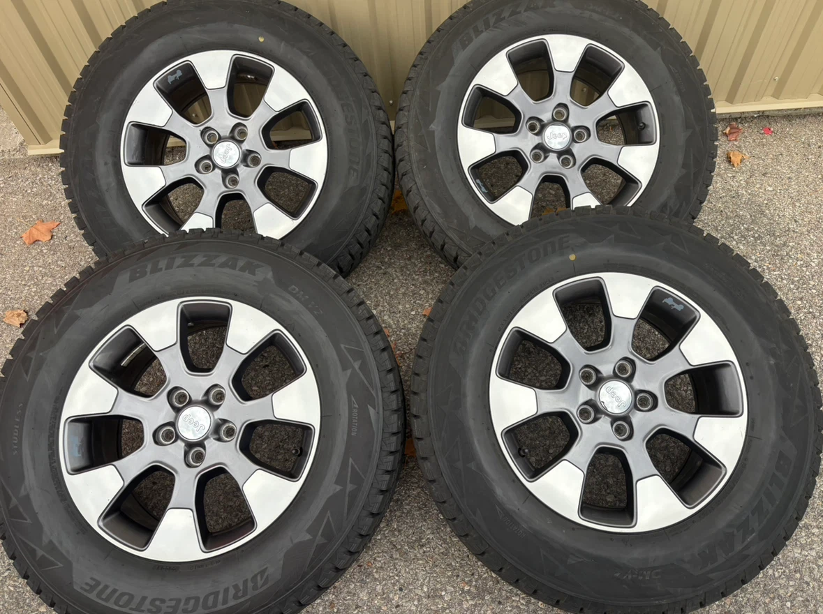 4 x 255/70/18 BRIDGESTONE WINTER TIRES AND JEEP RIMS $1550