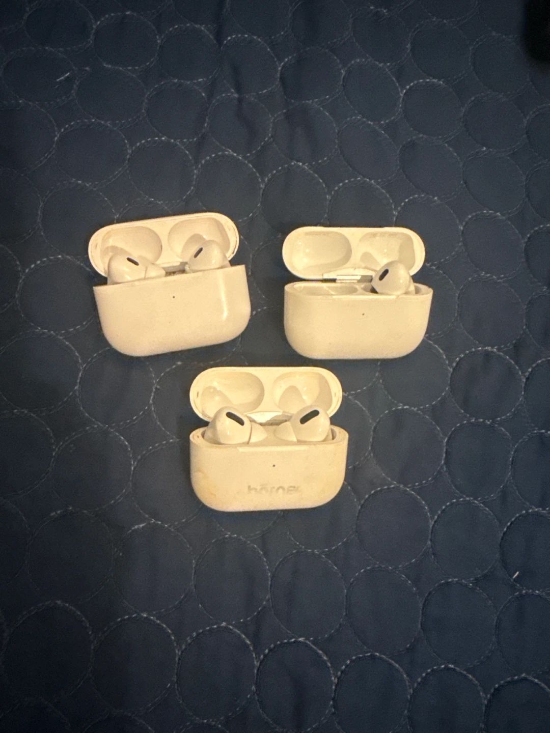Three Apple AirPods Pro Charging Cases