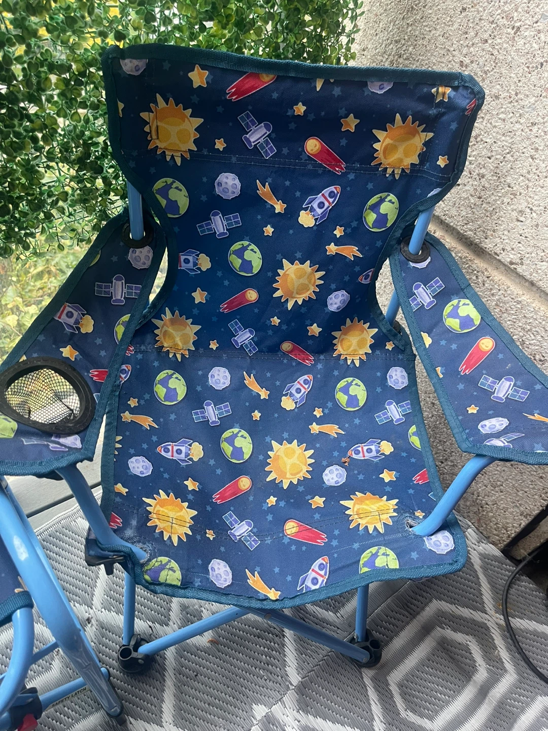 Two kids space-themed folding camping chairs