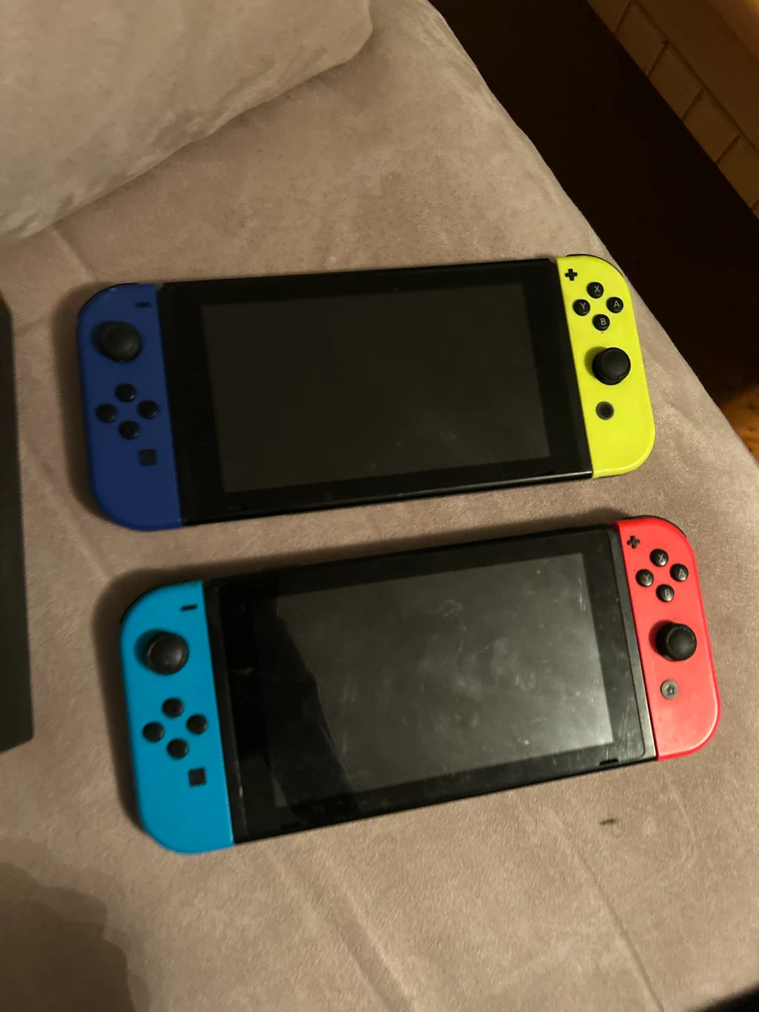 Two Nintendo Switch consoles with dock and cables - photo 2